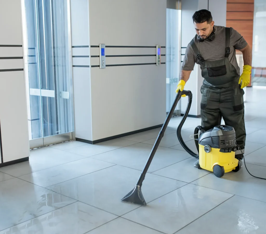 full-shot-man-vacuuming-office-floor